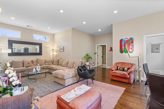 Living room with baseboards, visible vents, wood finished floors, and recessed lighting | Image 9