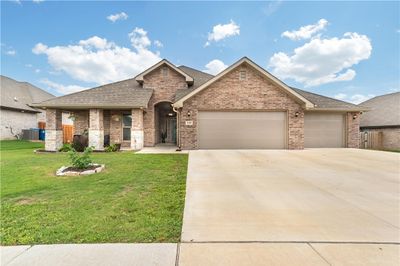 Welcome to 2419 England Lane! All brick house with 3-car garage and covered front porch. | Image 1