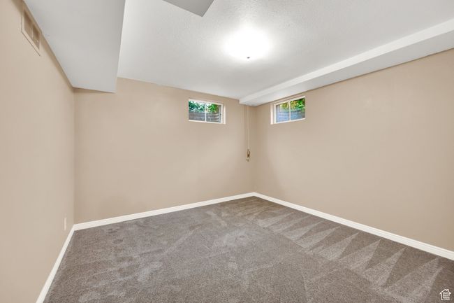 Below grade area featuring carpet and baseboards | Image 17