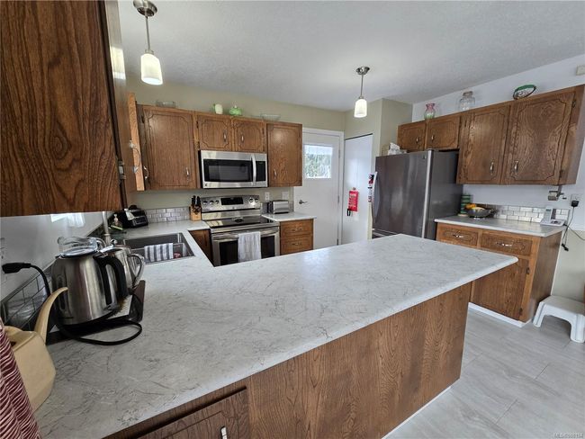 7071 Mc Dougal Pl, House other with 4 bedrooms, 3 bathrooms and 2 parking in Port Hardy BC | Image 10