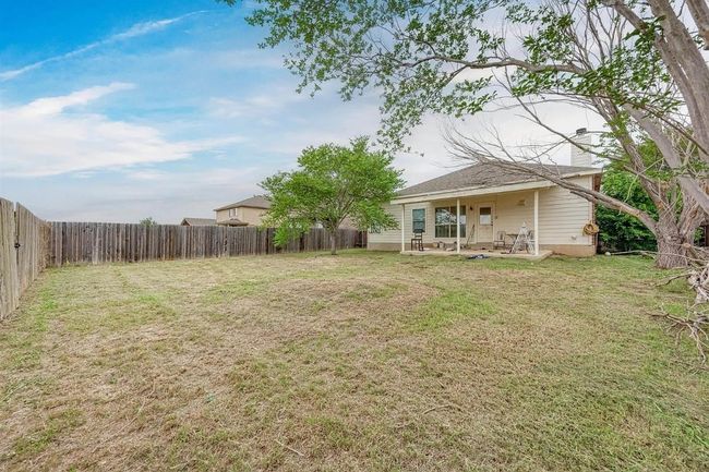 Fenced backyard featuring a patio area | Image 18