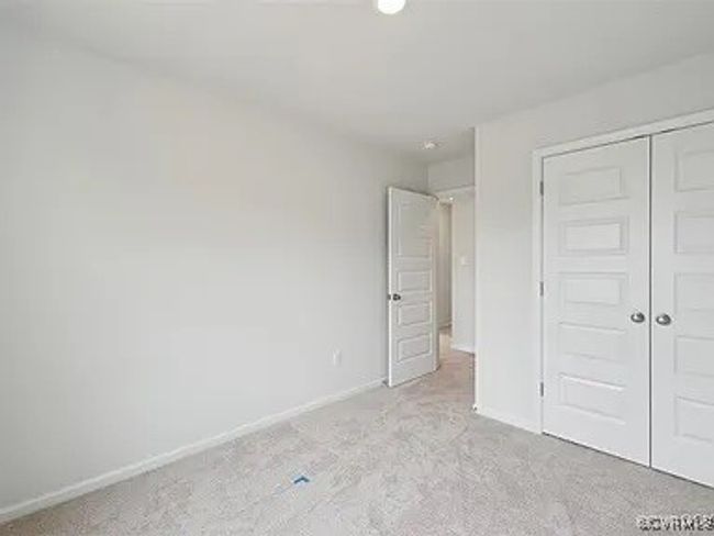 Unfurnished bedroom featuring light colored carpet and a closet | Image 20