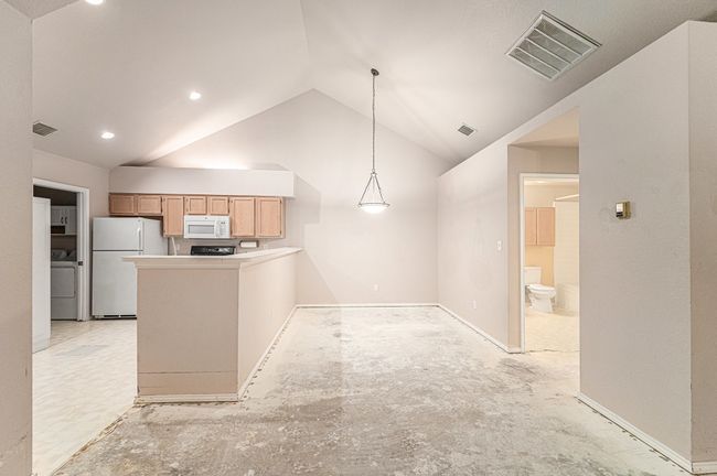 Nice size dining area. Carpet has been removed, and it reveals the concrete. | Image 4