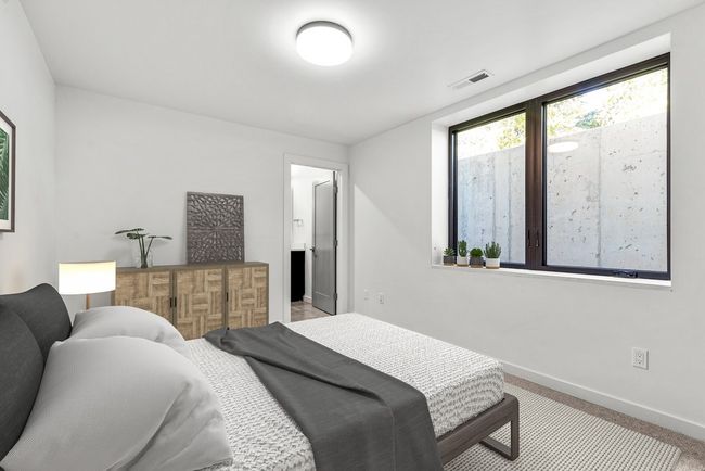 Lower Level bedroom #3 virtually furnished, Egress window well has ladder for exit | Image 12