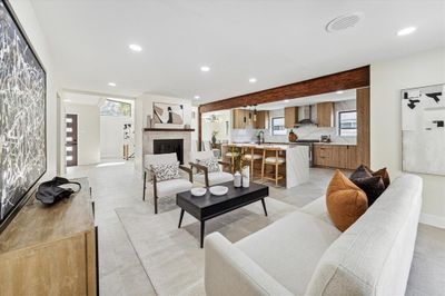 New custom cabinetry, fresh interior paint, and elegant tile flooring enhance the home's modern appeal | Image 2