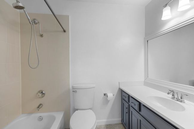Full bathroom featuring vanity, shower / tub combination, and baseboards | Image 24