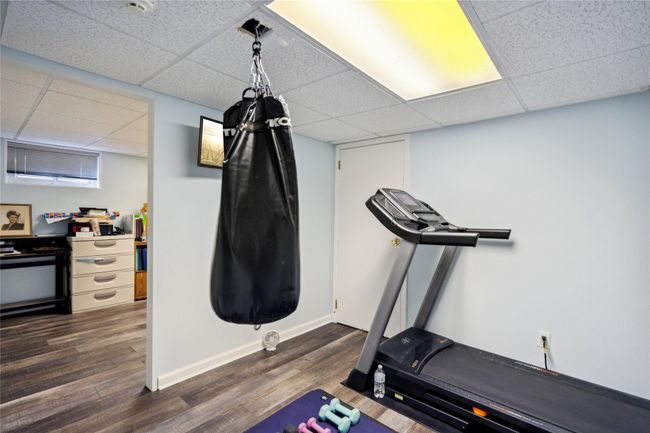 Exercise area featuring a drop ceiling and dark wood-type flooring | Image 20
