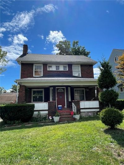 View of front of property with a porch and a front lawn | Image 1