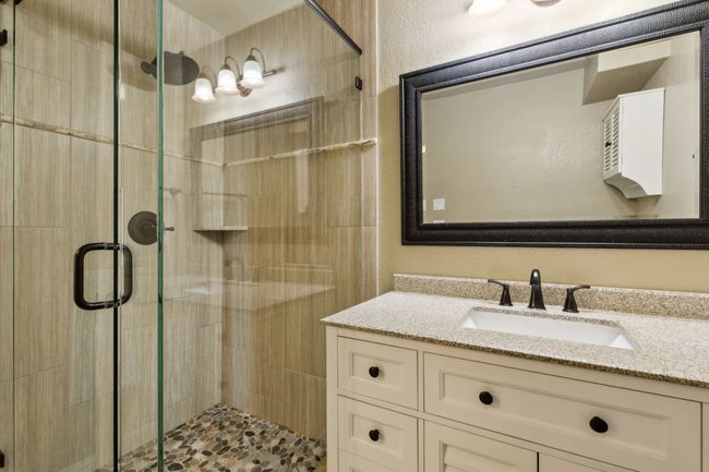 Bathroom with a stall shower and vanity | Image 7