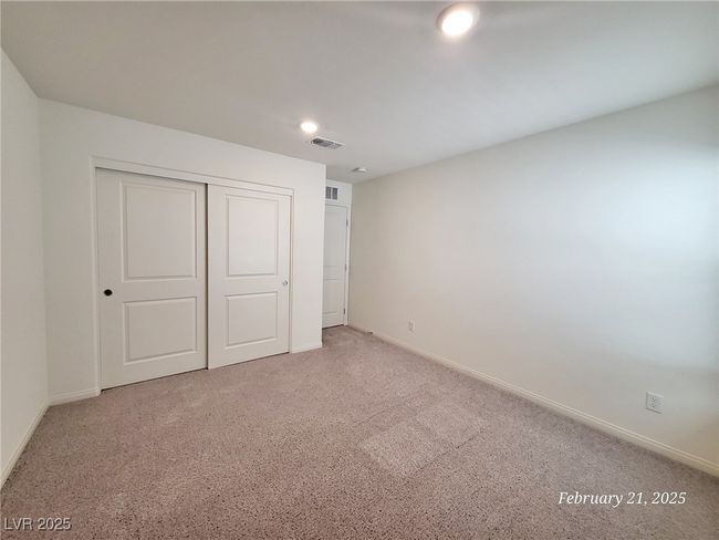 Unfurnished bedroom featuring carpet, a closet, visible vents, and baseboards | Image 7
