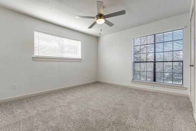 Carpeted empty room with ceiling fan | Image 38