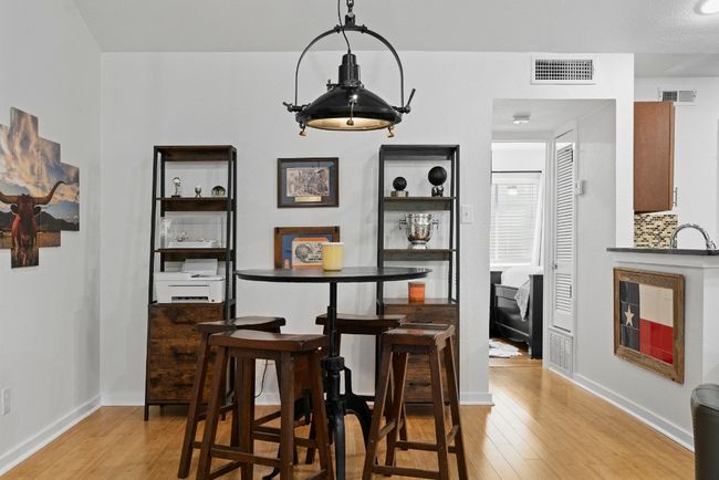 Dining room with light wood-style floors and baseboards | Image 15