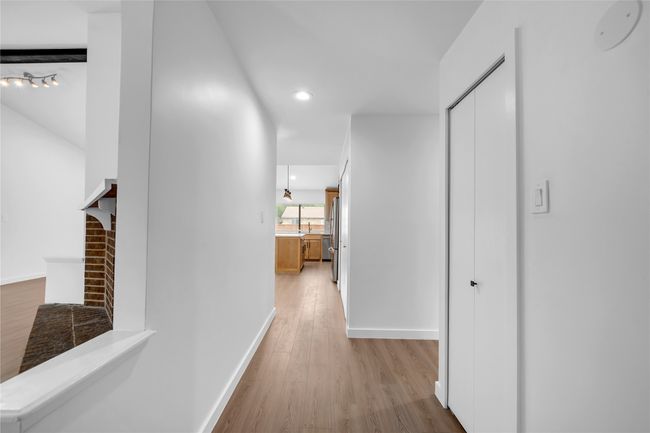 Corridor with light wood finished floors, baseboards, and recessed lighting | Image 5