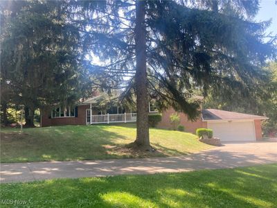 View of front of house with a garage and a front lawn | Image 2