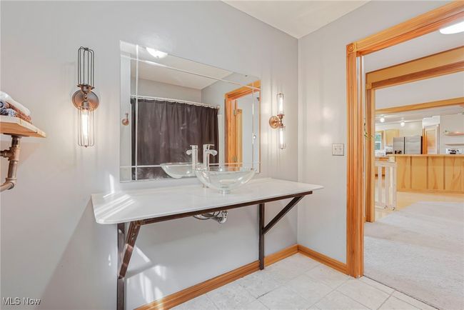 Full bathroom featuring tile patterned flooring and a shower with shower curtain | Image 24
