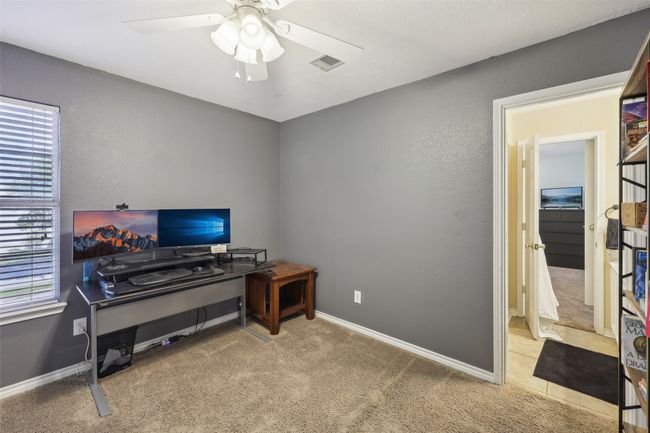Bedroom 2 is being used as a study. | Image 27