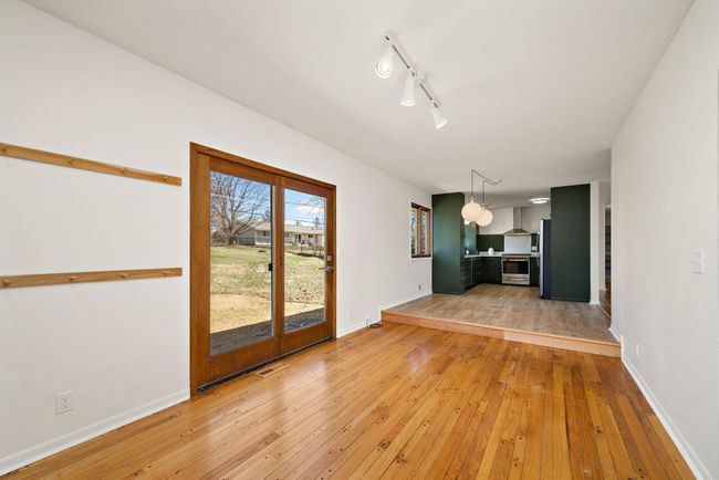 Extra seating area with access to the back yard and garage | Image 15