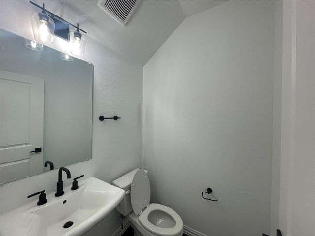 Half bath featuring toilet and a sink | Image 34