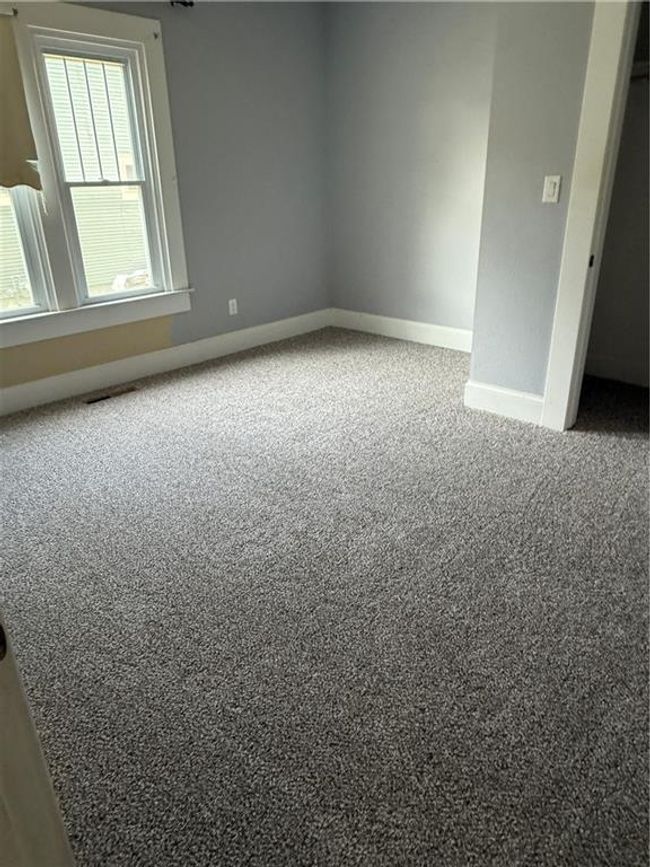 Carpeted empty room with baseboards | Image 13