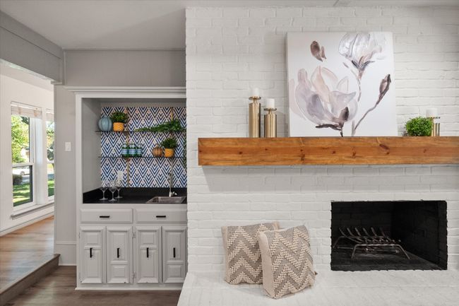Living room includes gorgeous fire place and wet bar! | Image 5
