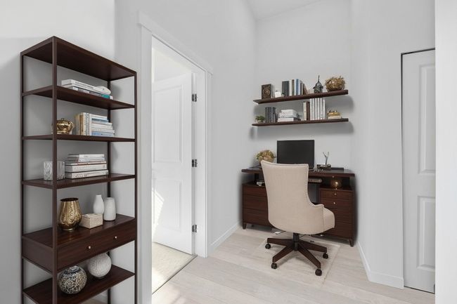 Office area with light wood finished floors and baseboards | Image 13