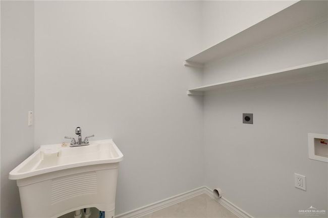 Washroom with hookup for an electric dryer and washer hookup | Image 16