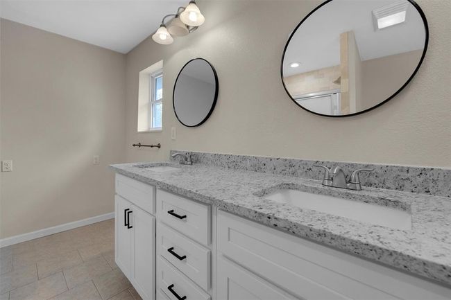 Bathroom featuring tile patterned floors and dual bowl vanity | Image 28