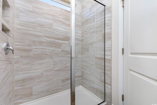Full bathroom featuring tiled shower | Image 26