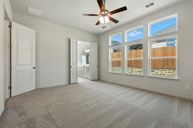 Unfurnished bedroom with carpet flooring and ceiling fan | Image 19