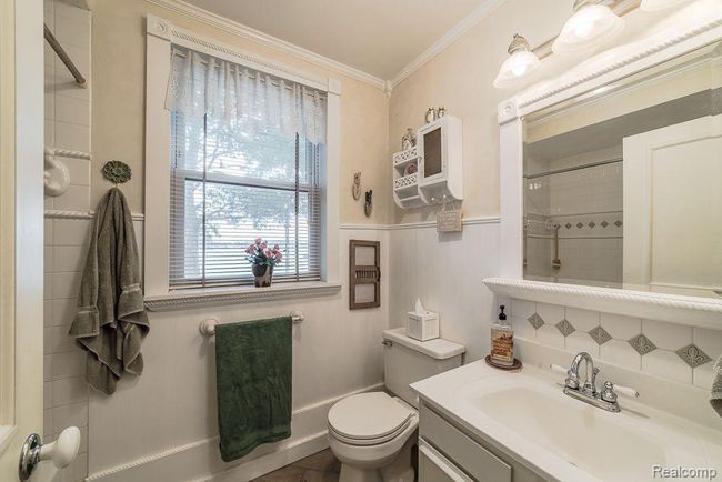 Full bathroom with tile floor & custom trim | Image 28