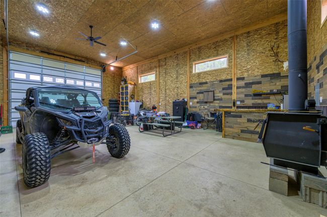 Garage featuring a wood stove | Image 46