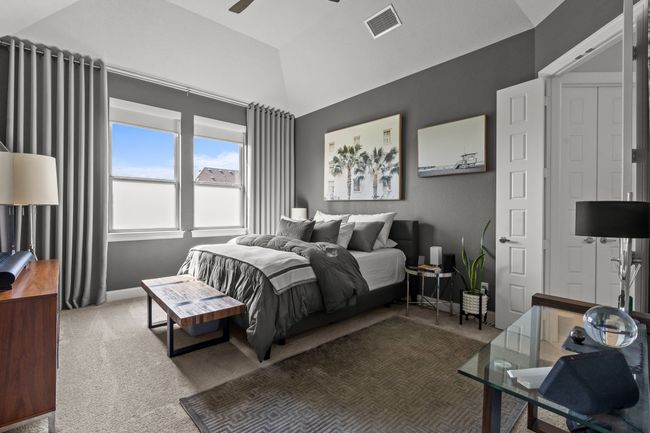 Bedroom featuring carpet floors, lofted ceiling, and ceiling fan | Image 14