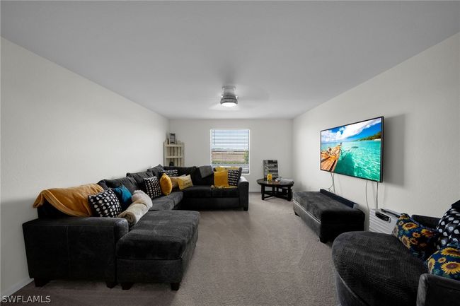 Living room featuring carpet and ceiling fan | Image 30