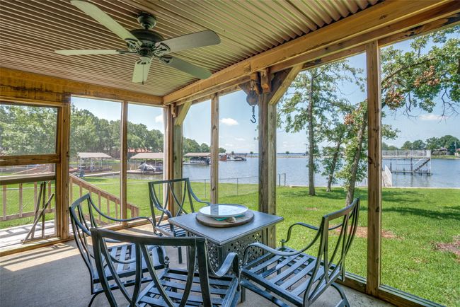 Sunroom / solarium featuring water view | Image 21