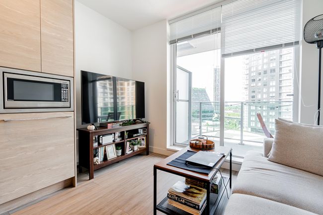 Living room with baseboards and wood finished floors | Image 12