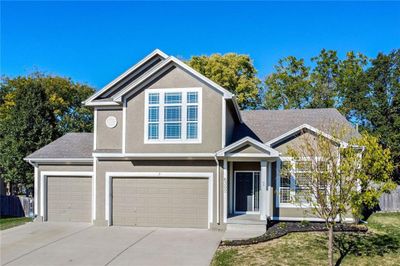 3 Car Garage with Triple Wide Driveway and Updated Landscaping | Image 1