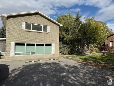 View of side of home with a garage | Image 3