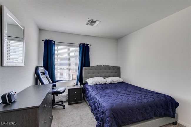 Bedroom featuring visible vents and carpet | Image 17