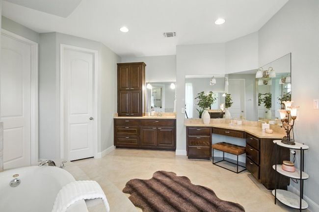 Full bathroom featuring vanity, a tub to relax in, tile patterned flooring, and recessed lighting | Image 19
