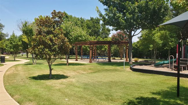 Well manicured HOA maintained private park and Playgrounds. | Image 19