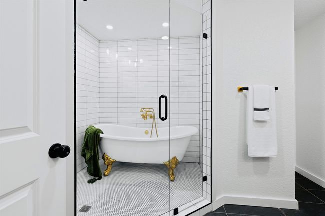 Bathroom with tile patterned floors and a soaking tub | Image 20