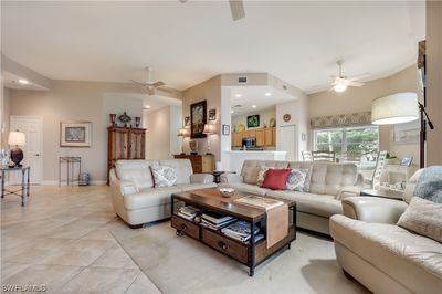 open living space w/tile flooring & 11’ Ceiling! | Image 3