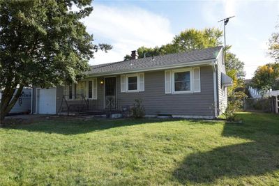 View of front of house with a front lawn and a garage | Image 1