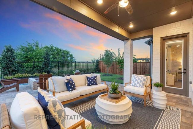 Fenced backyard featuring outdoor lounge area, a patio area, and a ceiling fan | Image 37