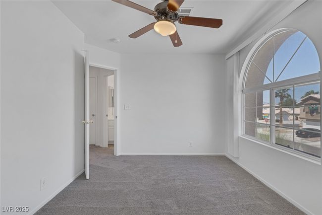 Carpeted spare room with a ceiling fan and a smoke detector | Image 15