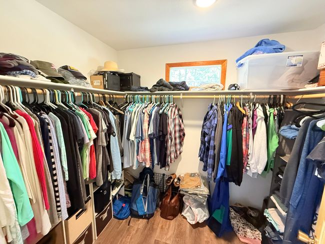 Large Walk in closet with wood finished floors | Image 36