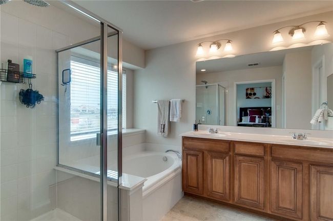 Bathroom with vanity and independent shower and bath | Image 22
