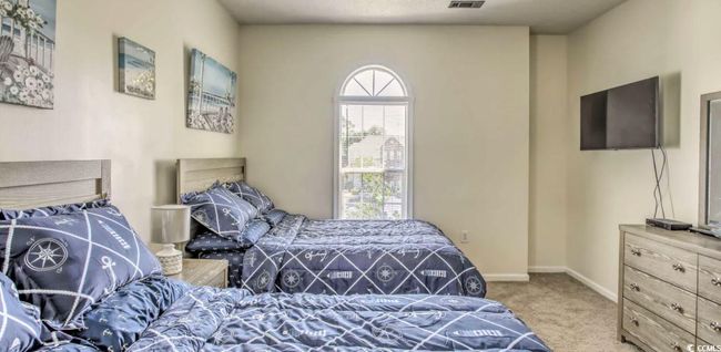 Bedroom featuring carpet flooring and baseboards | Image 17