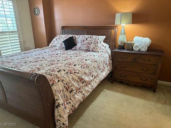 Carpeted bedroom with baseboards | Image 9