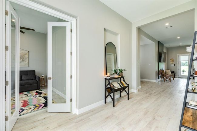 Right off the entryway is the private home office. | Image 6